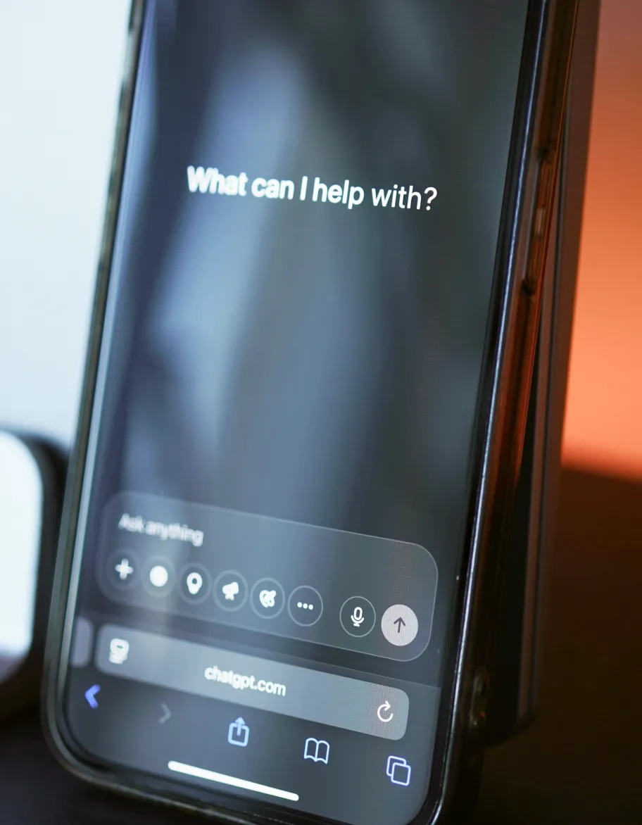 Smartphone displaying AI chatbot interface being evaluated for quality