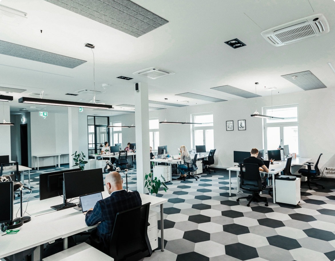 Software engineers working quietly at a TestDevLab office.