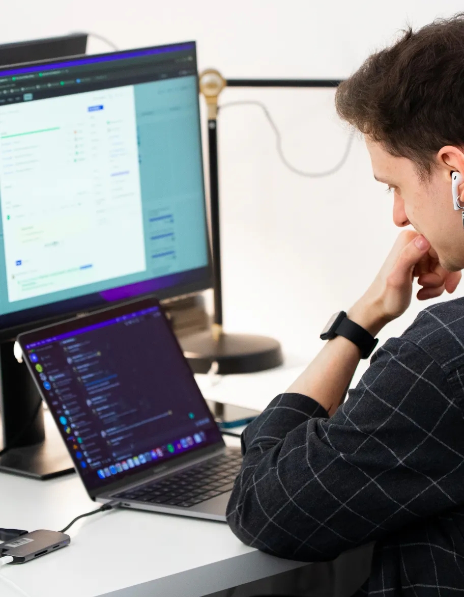 QA engineer staring at the laptop's screen.