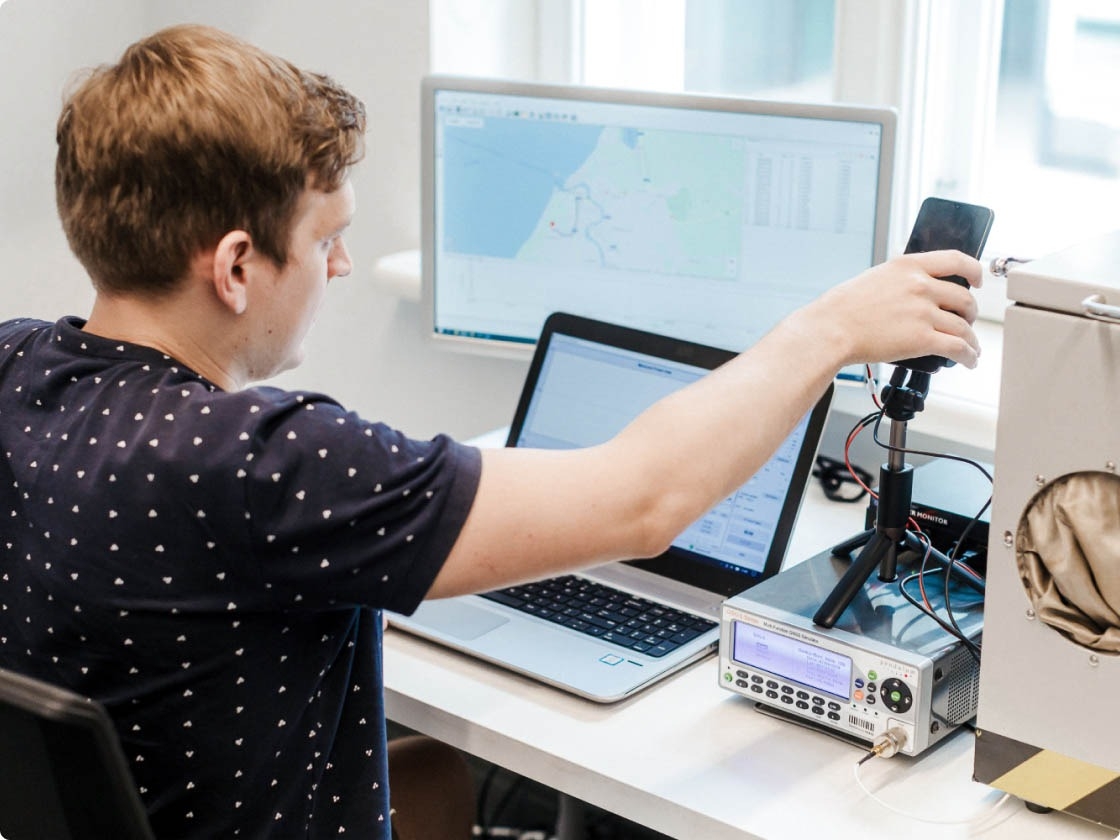 QA engineer working on location testing setup.