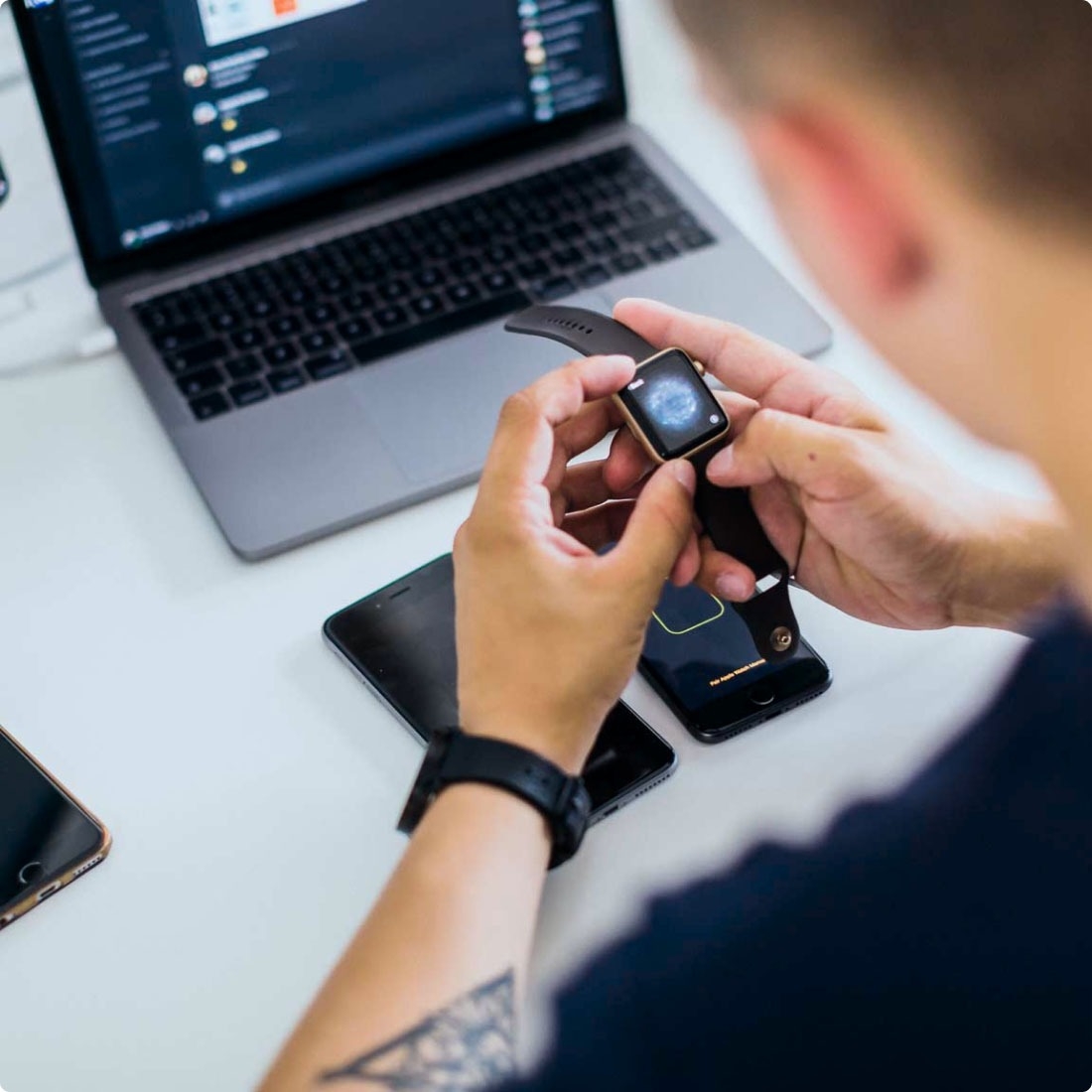 QA engineer testing the security of a smartwatch.