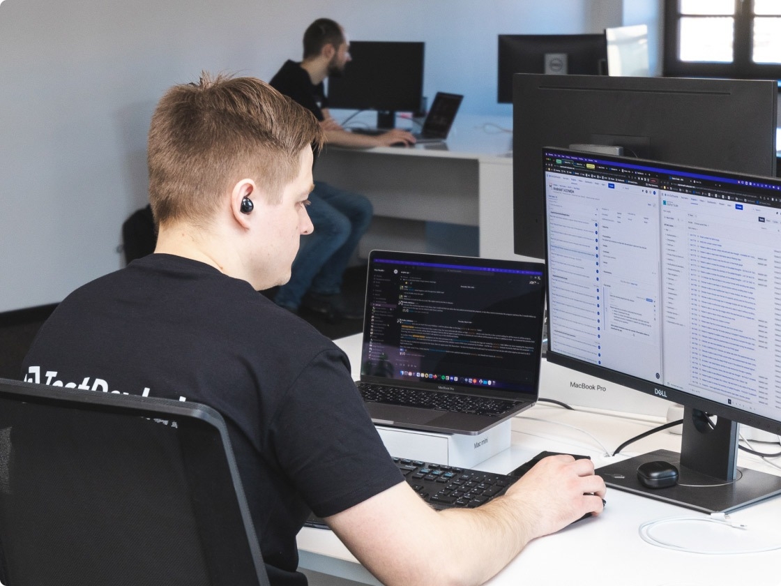 QA engineer uploading screen recording with issue caught from mobile device to computer.