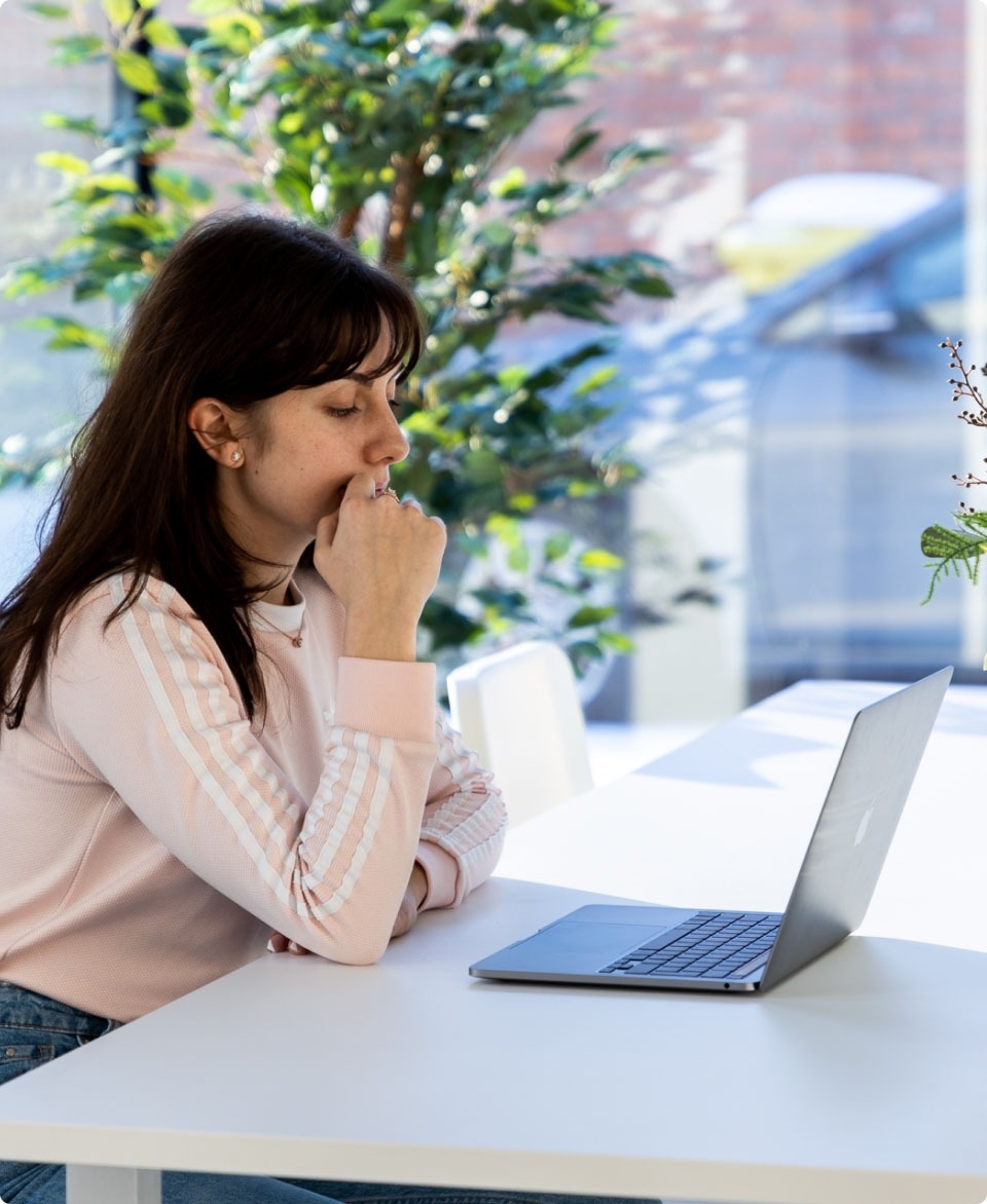 QA engineer thinking about how to solve a software issue.