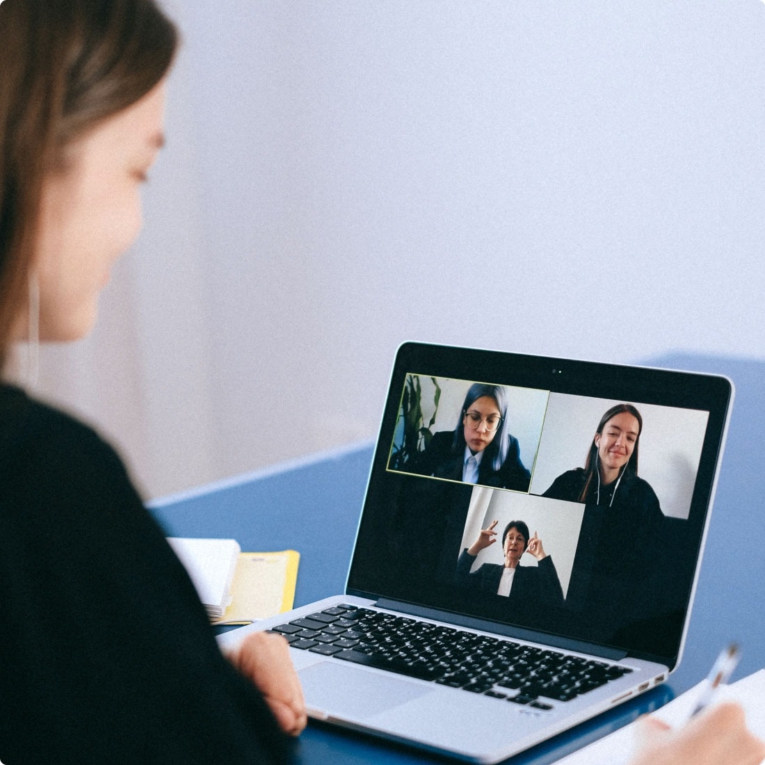 QA engineer participating in a video conference meeting with project representatives.