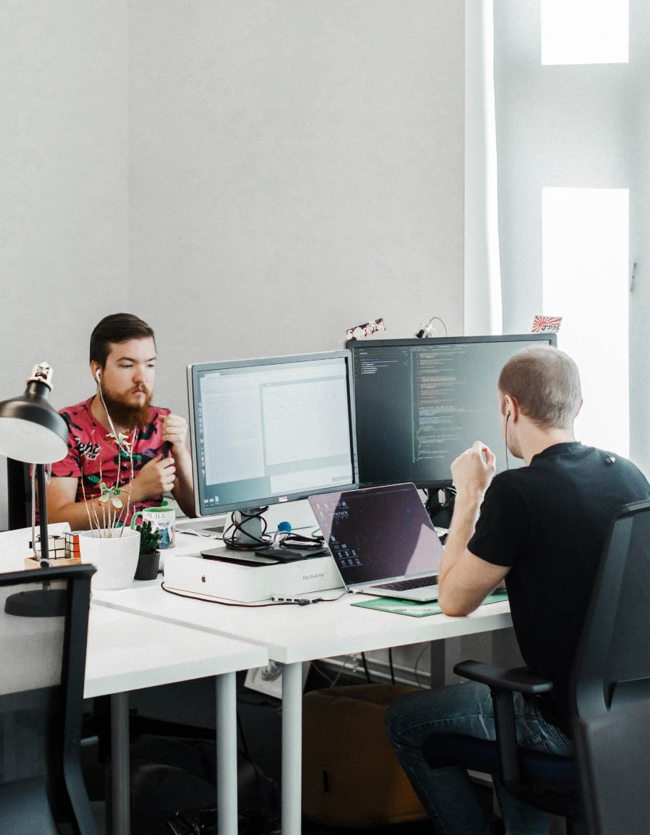 Two QA engineers working on API testing projects.