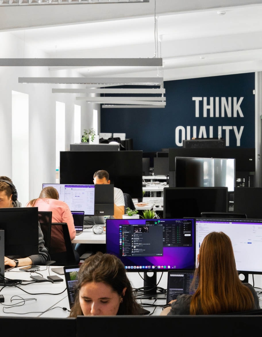 Group of QA engineers working on their desktop app testing projects.