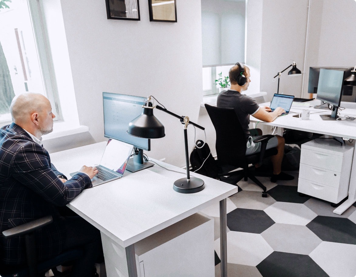 Two QA engineers performing software testing and immersed in their work.