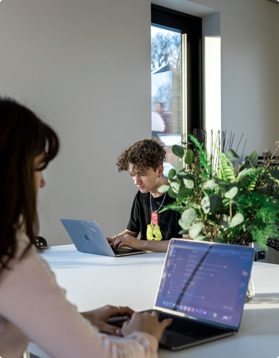 Two quality assurance engineers performing software testing.
