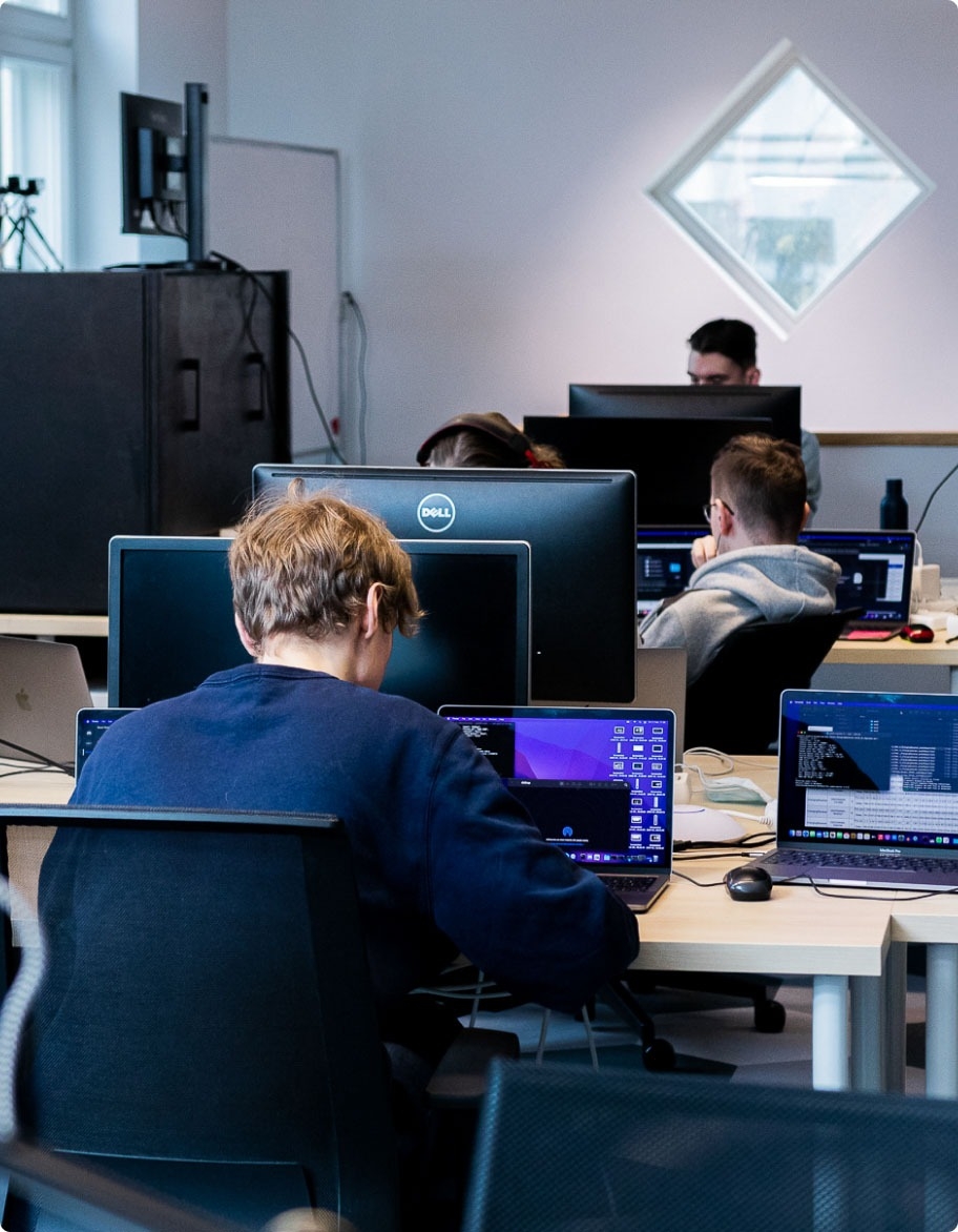 Team of QA engineers working on their manual testing projects.