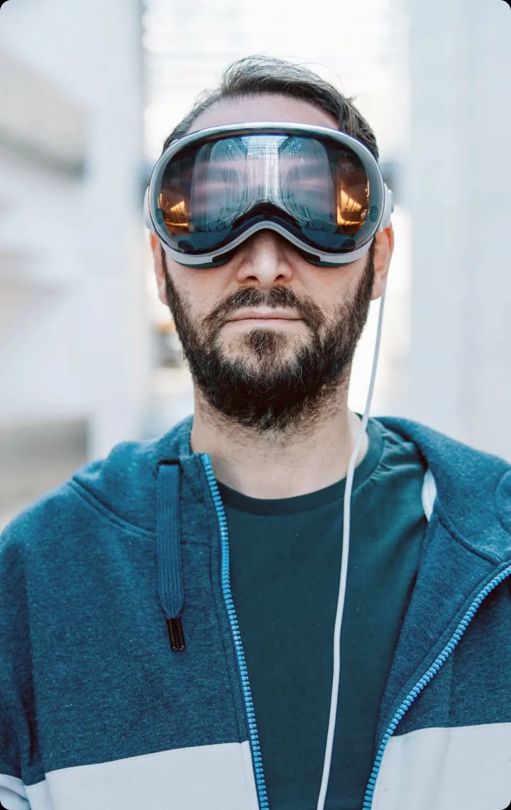 Man with beard wearing VR headset.