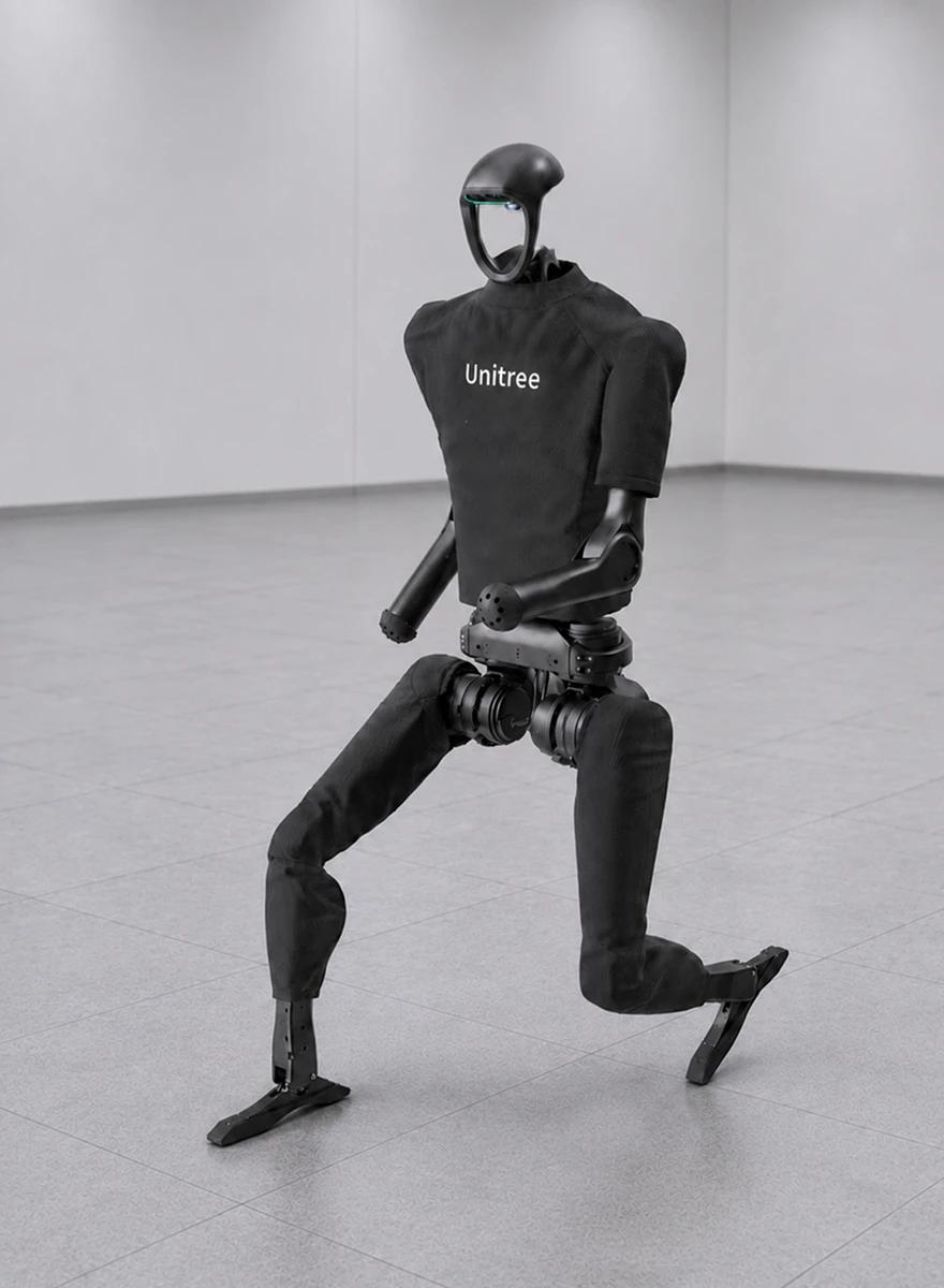 A black humanoid robot mid-stride in a bare concrete test room