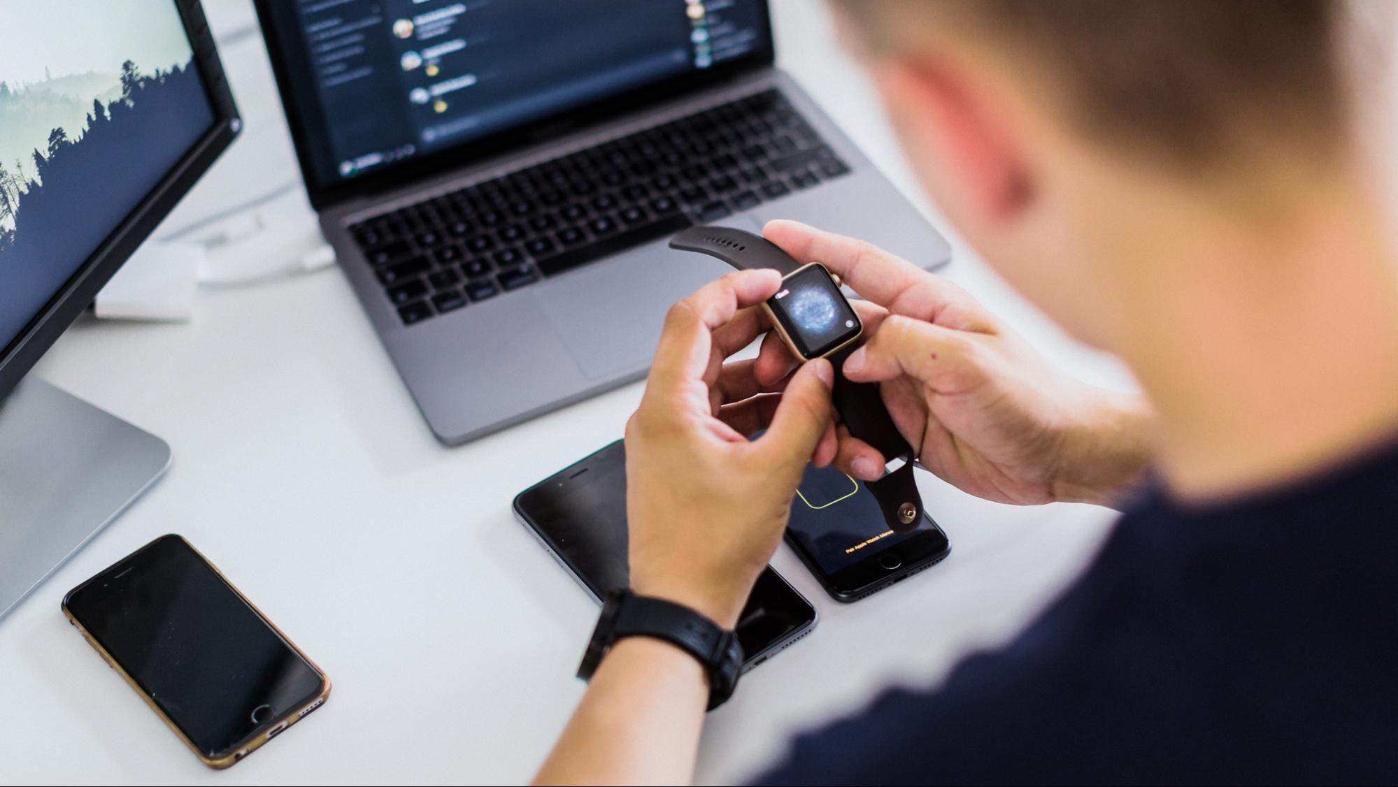QA engineer performing functional testing on wearable device