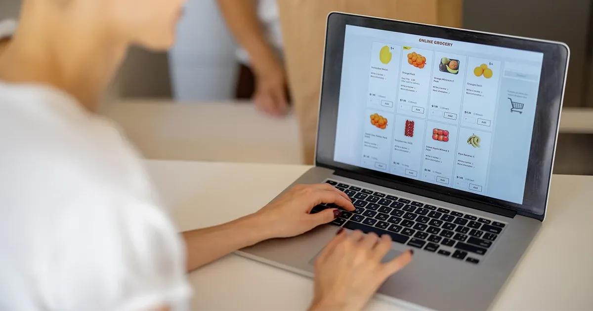 Woman shopping for groceries online.
