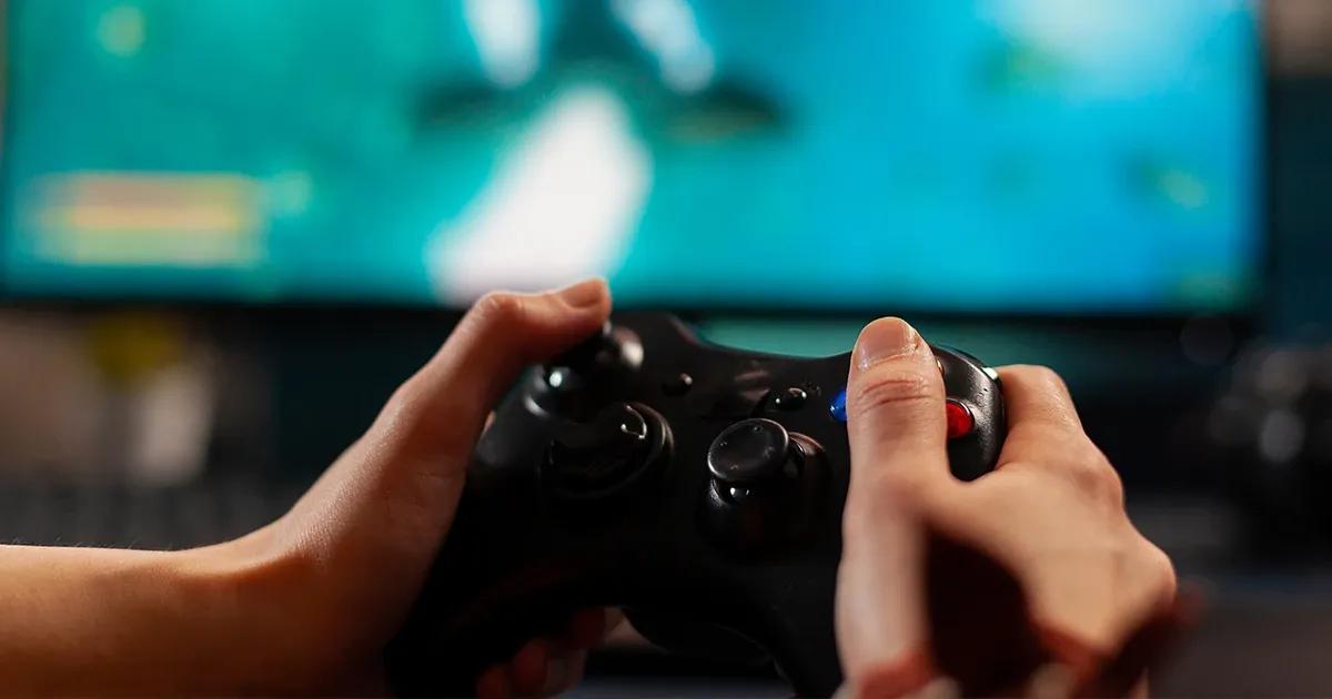 Person using a game console controller