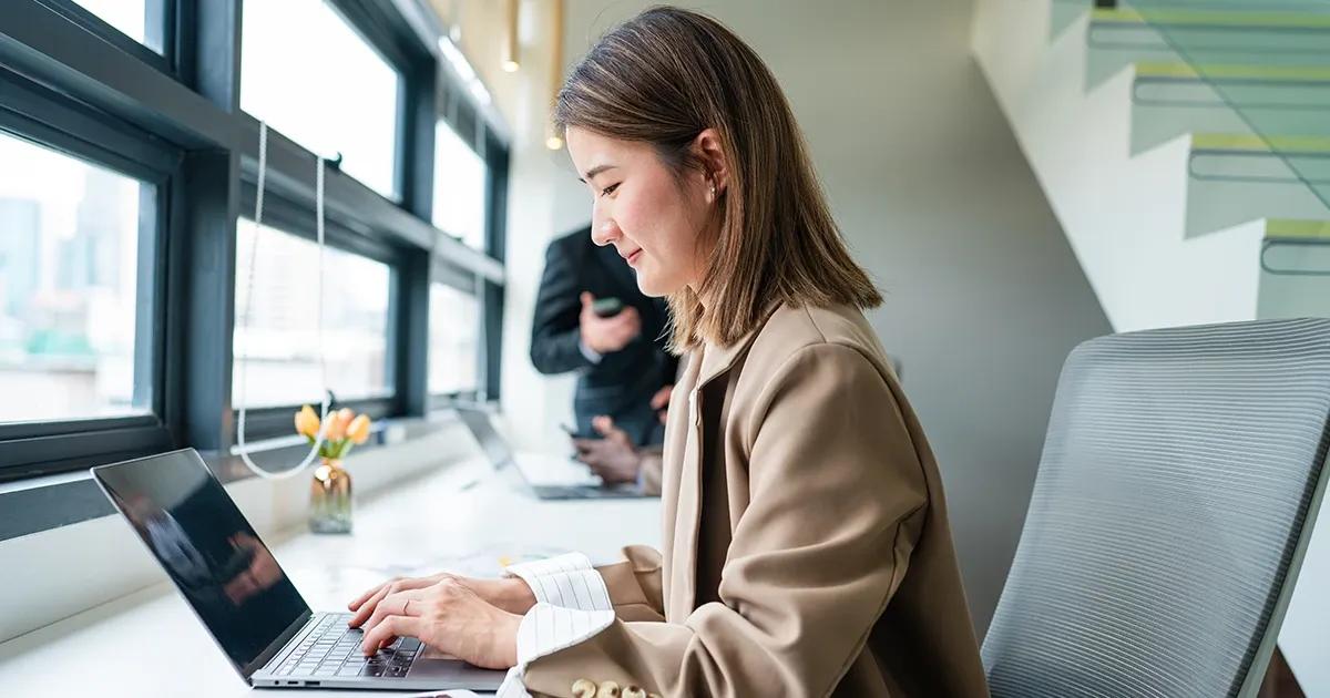Woman working on her laptop.