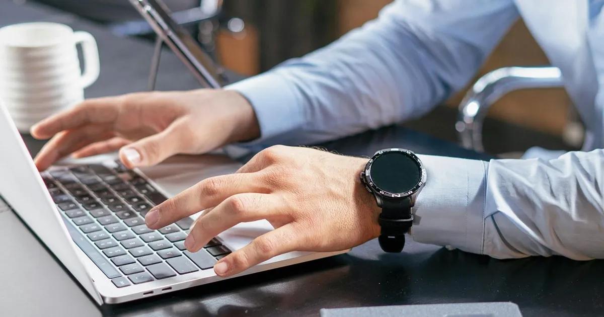 Closeup of man typing on laptop computer