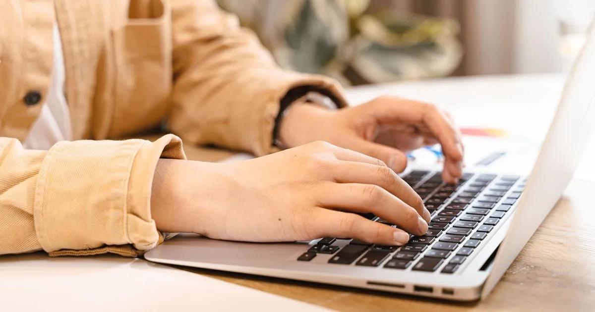 Person typing on laptop