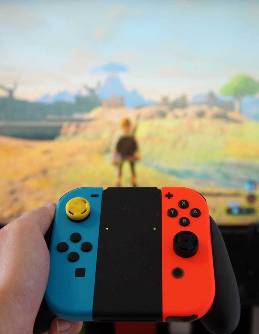 Software quality assurance engineer testing a game with the Nintendo Switch.