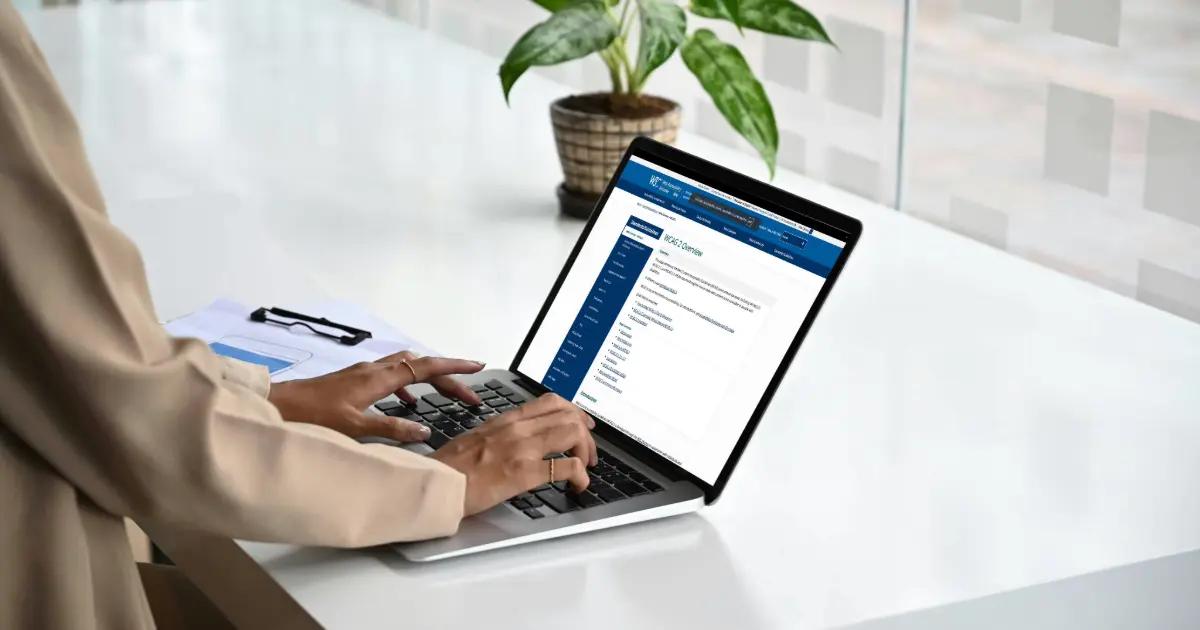 Woman typing on her laptop.