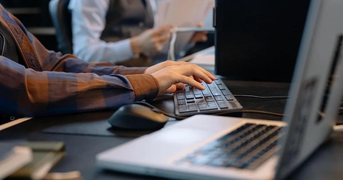 QA engineer typing on a keyboard