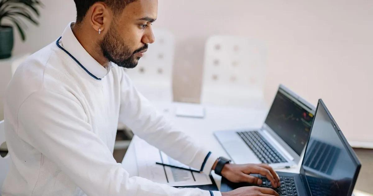 QA engineer using a QA tool on his laptop