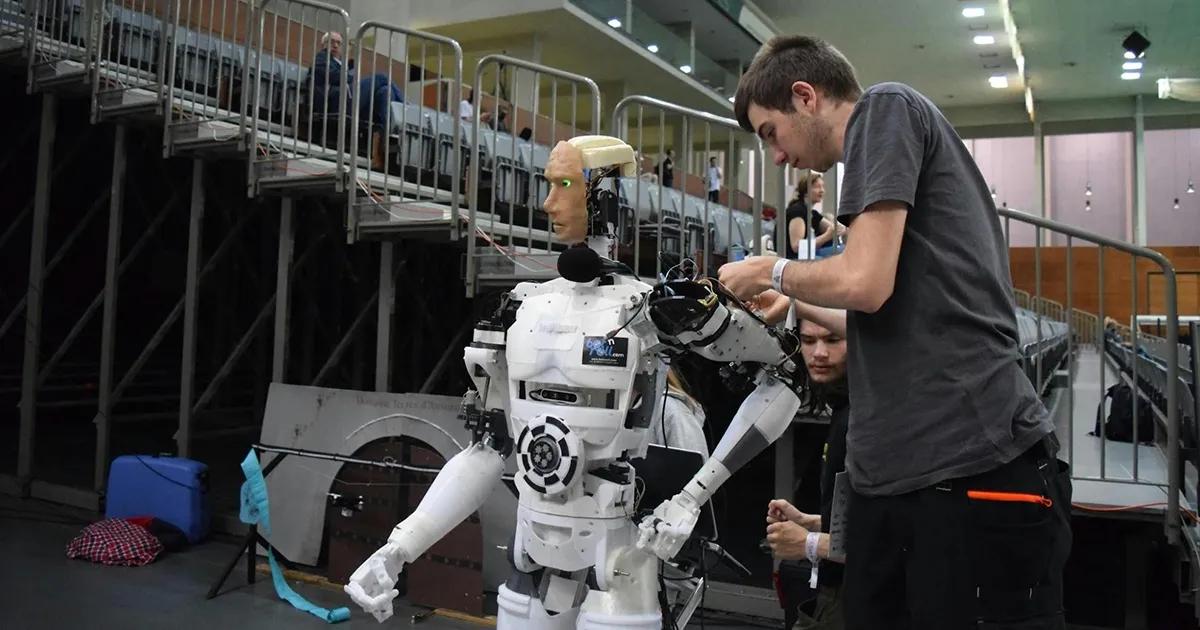 QA engineer testing a humanoid robot