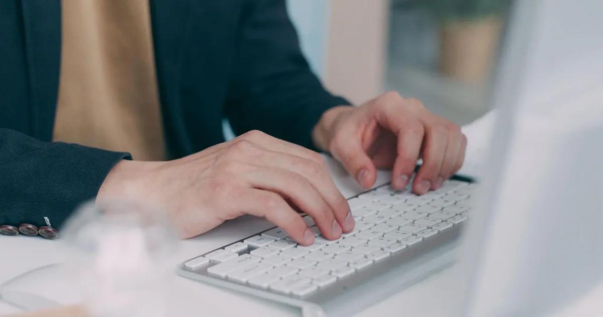 QA engineer typing on a keyboard