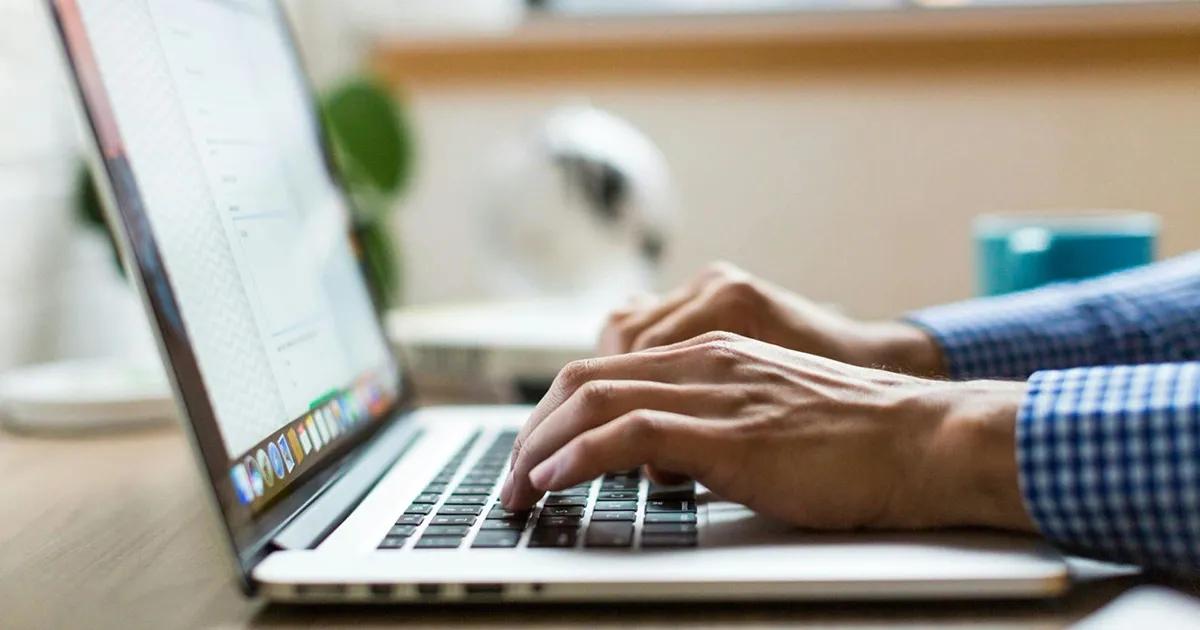 Person typing on a laptop