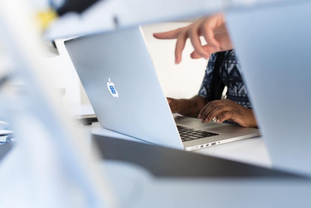 Software tester pointing at computer screen